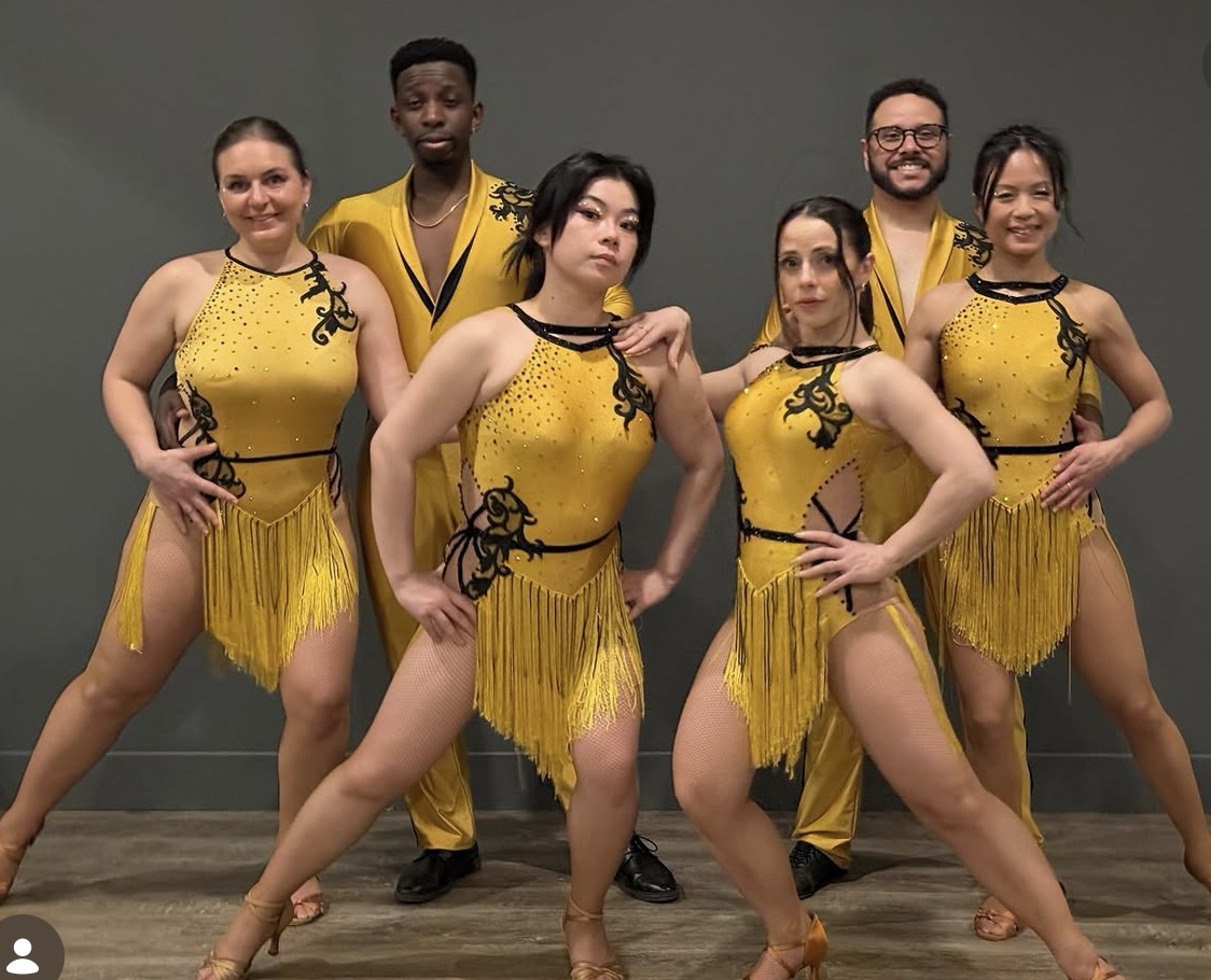 The EM Vivaldi Performance Team in gold costumes